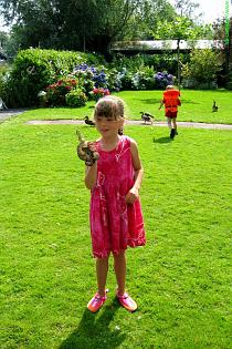 Girl plays with a boa 1